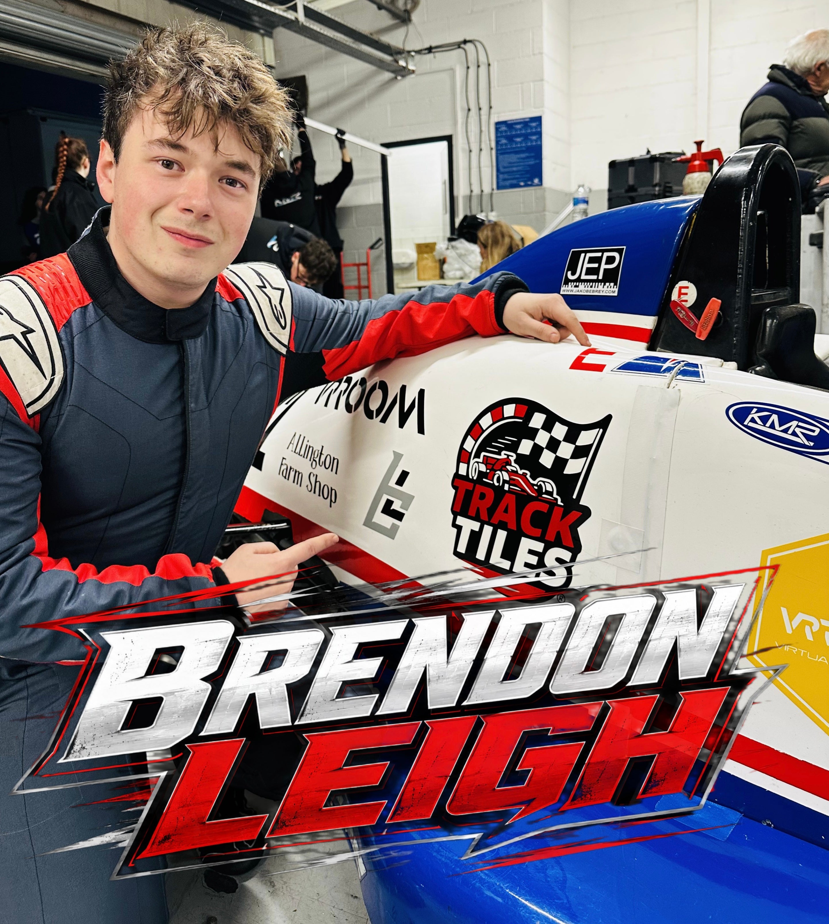 Brendon Leigh in a racing suit stands beside a white, blue, and red race car in a garage setting, with a large 'Brendon Leigh' graphic overlay at the bottom.